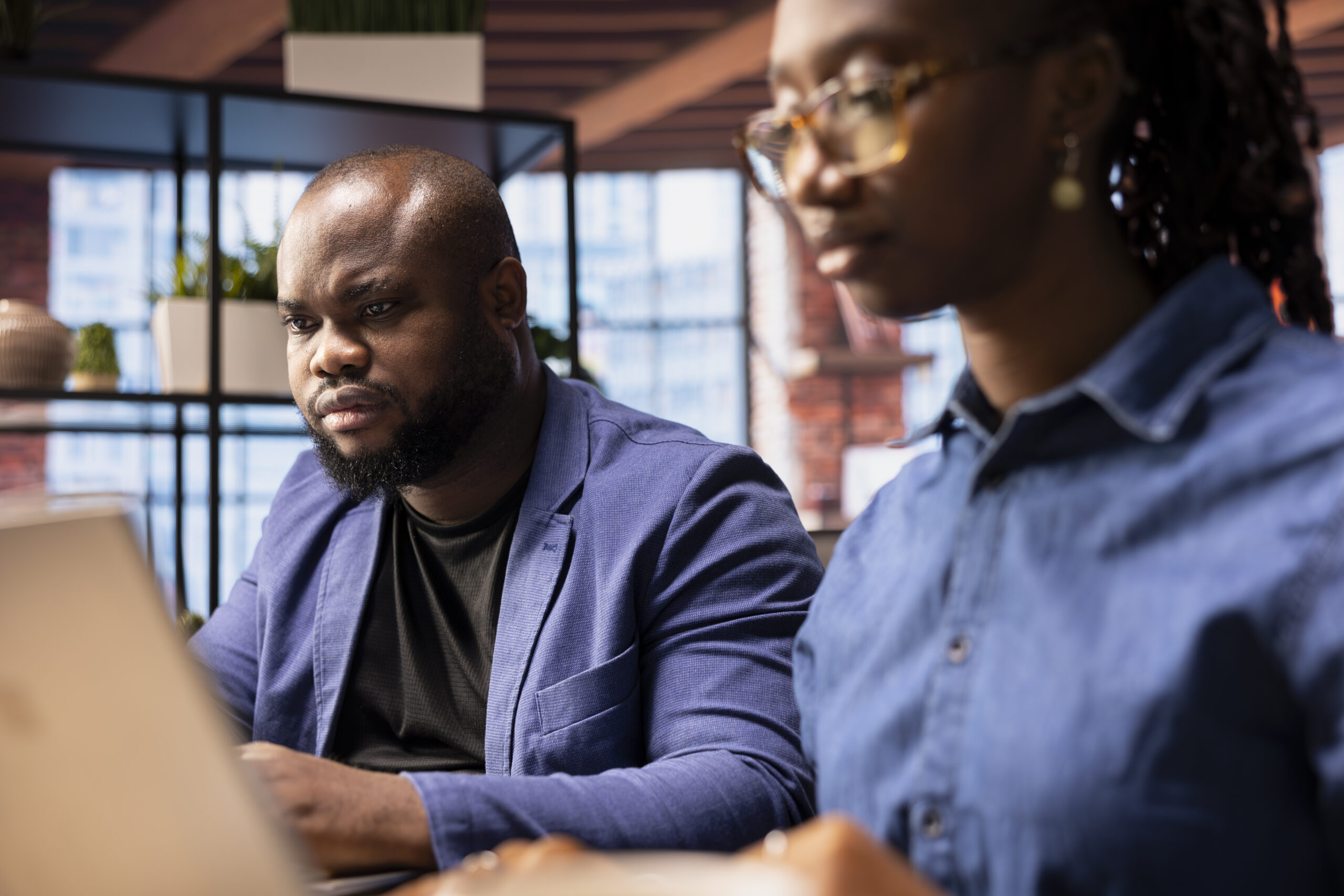 african american couple in their home office collaborate on a business project